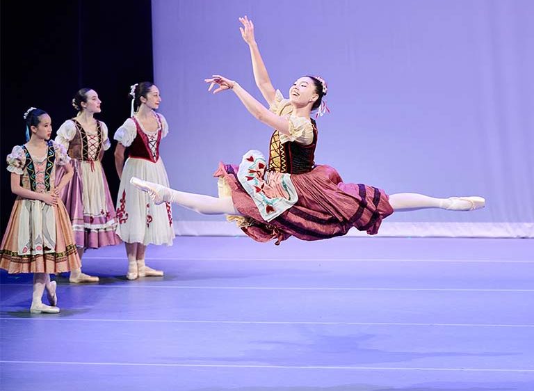 Ballet Eclectica dancer leaping in TRIumphant