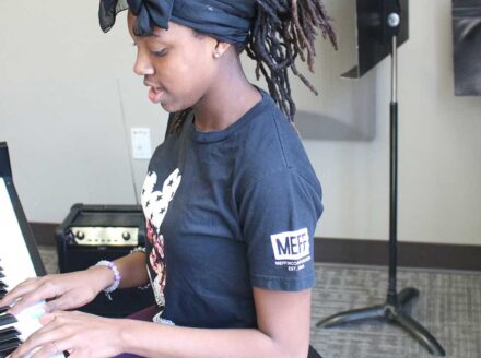 COCA Songwriting Intensive student at piano