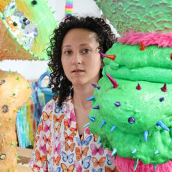 Artist Jasmine Raskas with works from Eternal Jungle Exhibition