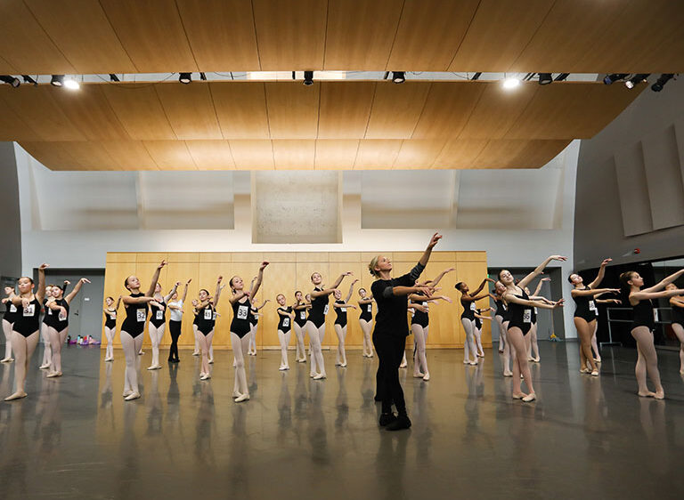 Ballet dancers in studio for center work