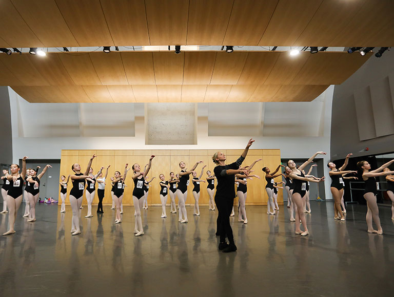 Ballet dancers in studio for center work